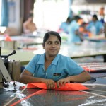 Lasanka sews the side stiching on a Panther panel.