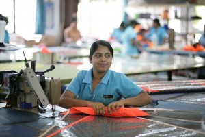 Lasanka sews the side stiching on a Panther panel.