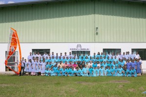 Here are all the Ezzy Sails workers lined up behind the main factory building.